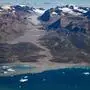 (FILES) This aerial photograph taken on August 11, 2023, shows a glacier around "Constable Point" severely melted due to warm temperatures along the Scoresby Sound Fjord, in Eastern Greenland. Global temperatures "smashed" heat records last year, as heatwaves stalked oceans and glaciers suffered record ice loss, the United Nations said on March 19, 2024, warning 2024 was likely to be even hotter. The annual State of the Climate report by the UN's World Meteorological Organization confirmed preliminary data showing 2023 was by far the hottest year ever recorded. (Photo by Olivier MORIN / AFP)