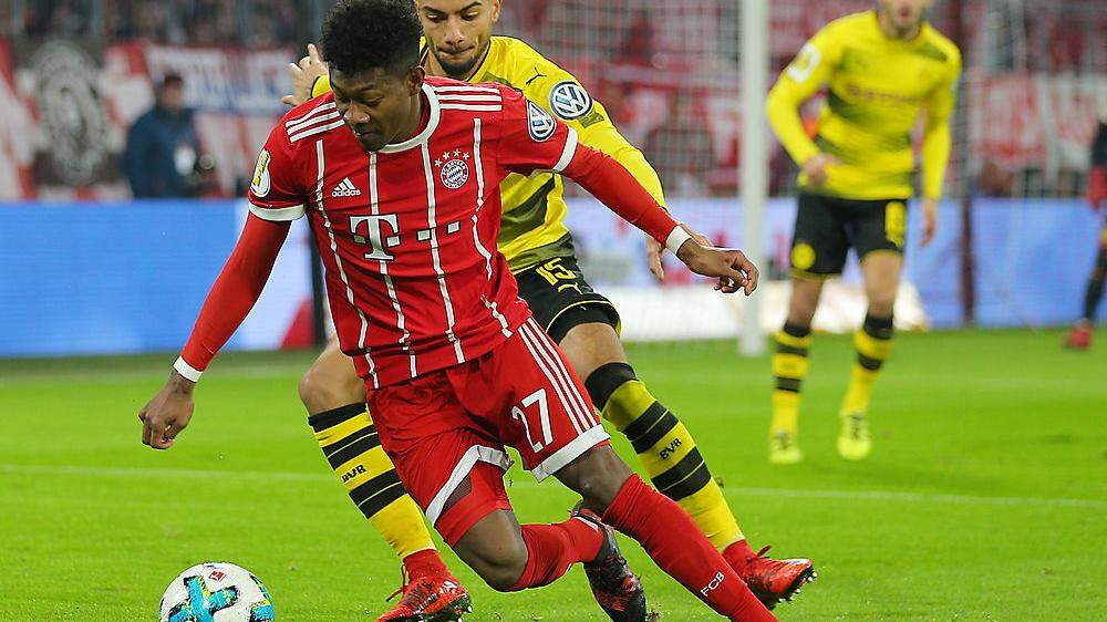 David Alaba (in rot) ist mit den Bayern in Dortmund gefordert