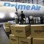 FILE - In this Thursday, Aug. 4, 2016, file photo, Amazon.com boxes are shown stacked near a Boeing 767 Amazon "Prime Air" cargo plane on display in a Boeing hangar in Seattle. Retail subscription programs, such as Amazon Prime, promise free shipping to members for a monthly or yearly fee. As shoppers demand speed, some cyberstores are offering free and fast shipping, albeit with minimum-purchase requirements. Certain situations, however, may warrant paying the membership fee. (AP Photo/Ted S. Warren, File)