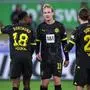 (L-R) Dortmund's German forward #18 Youssoufa Moukoko, German midfielder #19 Julian Brandt, Austrian midfielder #20 Marcel Sabitzer and Turkish midfielder #06 Salih Ozcan chat during the German first division Bundesliga football match between VfL Wolfsburg and BVB Borussia Dortmund in Wolfsburg, western Germany on February 17, 2024. (Photo by Ronny Hartmann / AFP) / DFL REGULATIONS PROHIBIT ANY USE OF PHOTOGRAPHS AS IMAGE SEQUENCES AND/OR QUASI-VIDEO