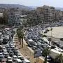 Cars sit in traffic as they flee the southern villages amid ongoing Israeli airstrikes, in Sidon, Lebanon, Monday, Sept. 23, 2024. (AP Photo/Mohammed Zaatari)