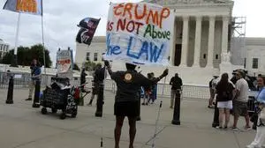 July 1, 2024, Washington, District Of Columbia, U.S: The Supreme Court Building seen the morning of the anticipated release of opinions in Corner Post, Inc. v. Board of Governors of the Federal Reserve System, Moody v. NetChoice, LLC, NetChoice, LLC v. Paxton, and Trump v. United States with a person holding a sign that reads, Trump is NOT Above the LAW on it. Washington U.S - ZUMAg228 20240701_zap_g228_004 Copyright: xEvanxGolubx