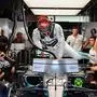 Mercedes' British driver Lewis Hamilton steps into his car during the third practice session at the Yas Marina Circuit in Abu Dhabi, a day ahead of the final race of the season, on November 30, 2019. (Photo by ANDREJ ISAKOVIC / AFP)