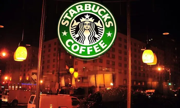 (FILES) In this file photo taken on February 03, 2011 the Starbucks logo is pictured at one of its chains in Washington, DC.
Starbucks announced April 17, 2018 that it would close more than 8,000 US stores on May 29 to conduct 