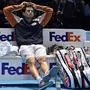 Austria's Dominic Thiem reacts as he waits for the trophy presentation to start, after losing the men's singles final match on day eight of the ATP World Tour Finals tennis tournament at the O2 Arena in London on November 17, 2019. - Greece's Stefanos Tsitsipas beat Austria's Dominic Thiem to win the match 6-7, 6-2, 7-6. (Photo by Glyn KIRK / AFP)