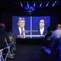 Republican presidential nominee former President Donald Trump and Democratic presidential nominee Vice President Kamala Harris are seen on a projector during a watch party at Massive, a queer nightclub, Tuesday, Sept. 10, 2024, in Seattle. (AP Photo/Lindsey Wasson)