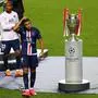 LISBON, PORTUGAL - AUGUST 23: Kylian Mbappe of Paris Saint-Germain removes his runners up medal as he leaves the pitch following during the UEFA Champions League Final match between Paris Saint-Germain and Bayern Munich at Estadio do Sport Lisboa e Benfica on August 23, 2020 in Lisbon, Portugal. 