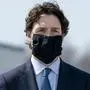 Prime Minister Justin Trudeau wears a mask at a repatriation ceremony for the six Canadian Armed Forces members killed in a helicopter crash off of Greece during Operation Reassurance, at CFB Trenton, Ont. on Wednesday, May 6, 2020. (Chris Young/The Canadian Press via AP)