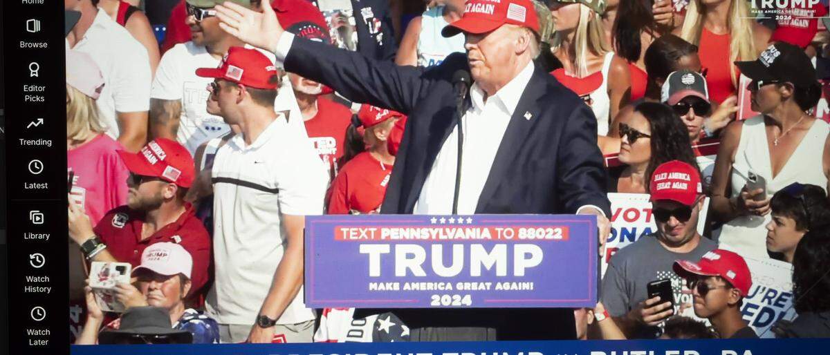 July 14, 2024, Butler, Pennsylvania, United States of America: A livestream on Rumble of Donald Trump being struck by gunfire during an assassination attempt was made on his life at a 2024 U.S. Presidential Election campaign rally in Butler Pennsylvania...President Donald Trump was grazed in the ear by a bullet in the from an alleged sniper from outside the MAGA campaign event perimeter from an elevated 1-story building. The U.S. Secret Service is reporting that two political supporters have been killed by gunfire and the alleged assailant was neutralized by law enforcement executive protection counter snipers. Butler United States of America - ZUMAb177 20240714_aap_b177_022 Copyright: xTaidghxBarronx