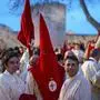 Penitents from the 'Real Hermandad del Santisimo Cristo de las Injurias, Cofradia del Silencio' brotherhood gather outside the cathedral prior to taking part in their procession, which was suspended due to the rain, during Holy Week in the northwestern Spanish city of Zamora on March 27, 2024. Christian believers around the world mark the Holy Week of Easter in celebration of the crucifixion and resurrection of Jesus Christ. (Photo by CESAR MANSO / AFP)