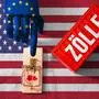 Germany - April 17, 2025: PHOTOMONTAGE, A hand with a European flag taps on a mousetrap above a US flag, next to it a container with the inscription: Tariffs. Symbolic image for trade conflicts and economic wars between Europe and the USA *** FOTOMONTAGE, Eine Hand mit europäischer Flagge tippt auf eine Mausefalle über einer US-Flagge, daneben ein Container mit der Aufschrift: Zölle. Symbolbild für Handelskonflikte und Wirtschaftskriege zwischen Europa und den USA