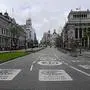 View taken of the empty Alcala street in Madrid on April 1, 2020, during a national lock-down to prevent the spread of the new coronavirus. - Spain confirmed another 864 deaths in 24 hours from the coronavirus today, bringing the total number of deaths to more than 9000. (Photo by JAVIER SORIANO / AFP)