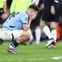 Manchester City's English midfielder #87 James McAtee reacts at the end of the UEFA Champions League football match between Manchester City and Feyenoord at the Etihad Stadium in Manchester, north west England, on November 26, 2024. Manchester City and Feyenoord equalised 3 - 3. (Photo by Darren Staples / AFP)