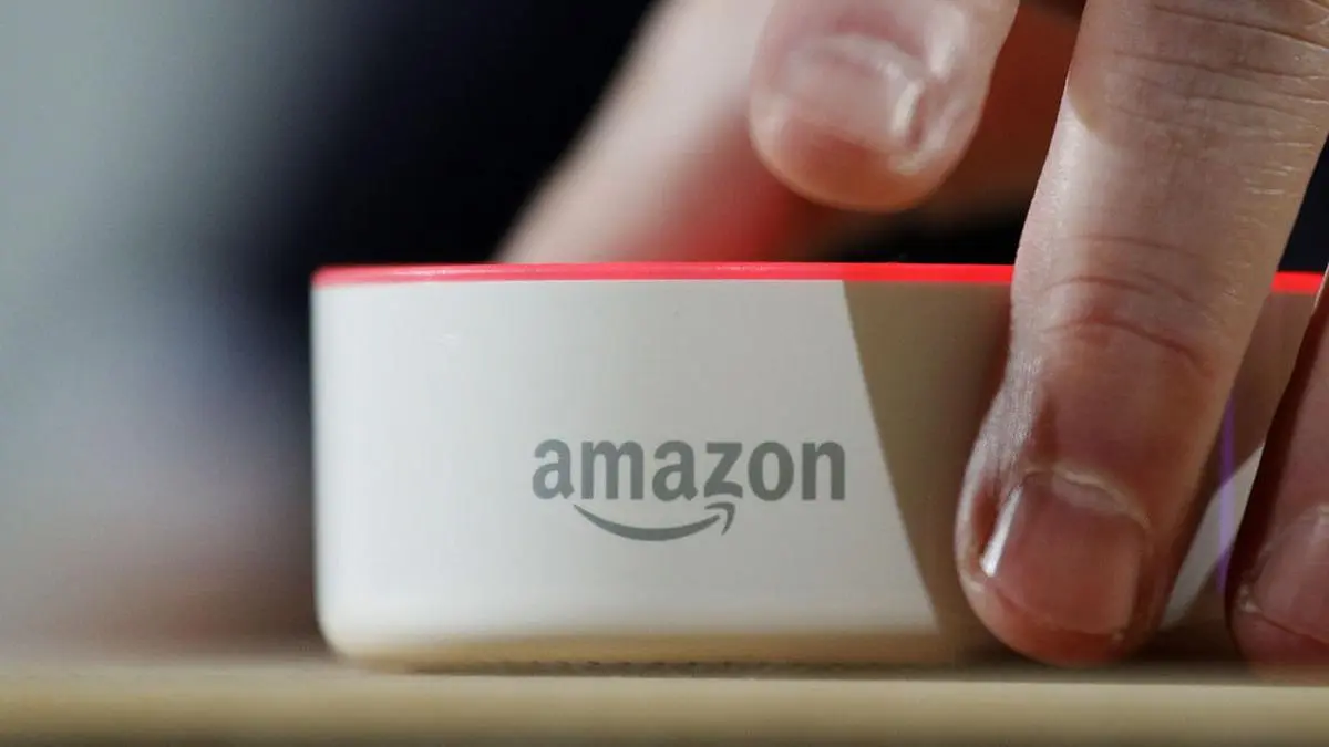 FILE - In this Wednesday, Sept. 27, 2017, file photo, an Amazon Echo Dot is displayed during a program announcing several new Amazon products by the company, in Seattle. Amazon.com, Inc. reports earnings Thursday, Feb. 1, 2018. (AP Photo/Elaine Thompson, File)