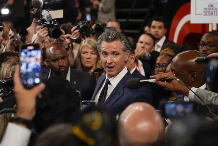 FILE - California Gov. Gavin Newsom speaks to reporters in the spin room after a presidential debate between President Joe Biden and Republican presidential candidate former President Donald Trump in Atlanta, June 27, 2024. In a statement released Tuesday, July 2, 2024, Newsom said there’s not enough time for state leaders to work out final language before the Wednesday night deadline. State leaders rolled out the proposed measure Sunday night after spending weeks unsuccessfully trying to negotiate a separate, more punitive proposal on the same subject off the ballot. (AP Photo/John Bazemore,File)