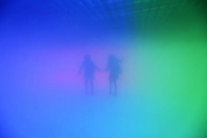 epa02401118 YEARENDER 2010 APRIL  Visitors explore inside an art installation entitled 'Feelings are Facts' a collaboration between world-renowned Danish-Icelandic artist, Olafur Eliasson, and leading Chinese architect, Ma Yansong, in Beijing, China, 11 April 2010. Using lights, mist and temperature, the art form lets viewers enter a space of fog and colours, with the aim of challenging their relationship with both nature and their urban environment.  EPA/HOW HWEE YOUNG