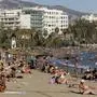 People gather at a beach during a hot day, as temperatures expect to edge over 40 degrees Celsius (104 Farenheit) in the next days, in Palaio Faliro suburb, south of Athens, Greece, Sunday July 6, 2025. (AP Photo/Yorgos Karahalis)