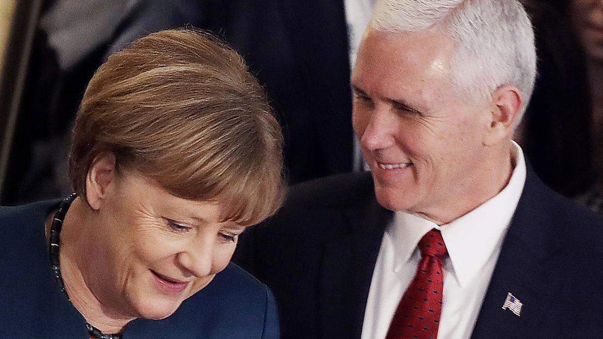 Mike Pence und Angela Merkel