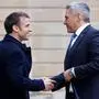 France's President Emmanuel Macron greets Austria's Chancellor Karl Nehammer (L) as he arrives at the Elysee presidential palace in Paris, on February 26, 2024, to take part in an international conference aimed at strengthening Western support for Ukraine. The meeting at the Elysee Palace will be a chance for participants to "reaffirm their unity as well as their determination to defeat the war of aggression waged by Russia in Ukraine", the French presidency said. (Photo by Ludovic MARIN / AFP)