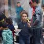 Palestinians line up for food in Rafah, on the southern Gaza Strip on February 7, 2024, amid ongoing battles between Israel and the militant Hamas group. (Photo by Mohammed ABED / AFP)