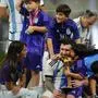 Argentina's Lionel Messi sits with his wife Antonella Roccuzzo after the World Cup final soccer match between Argentina and France at the Lusail Stadium in Lusail, Qatar, Sunday, Dec. 18, 2022. (AP Photo/Petr David Josek)