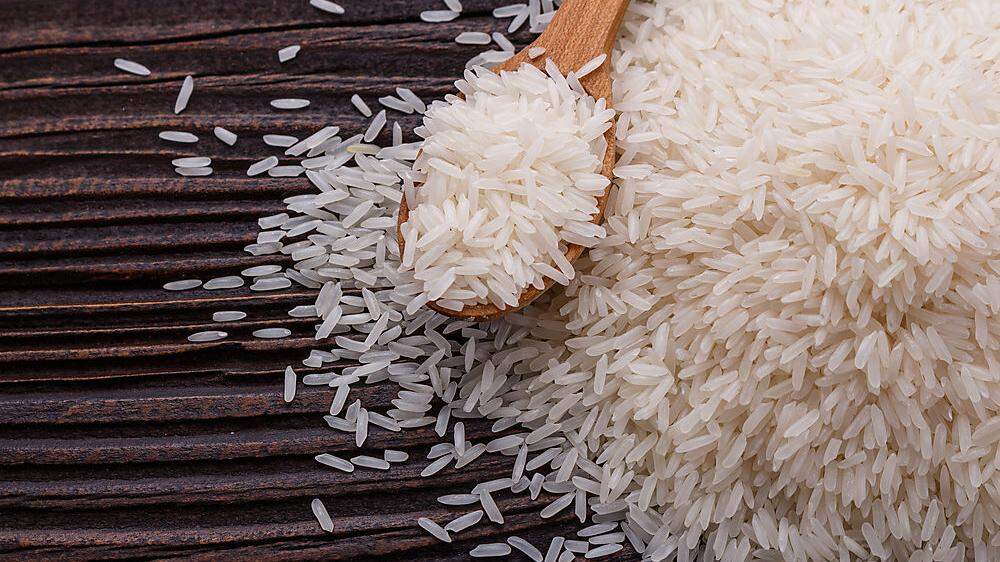 Jasmine rice on a wooden rustic background