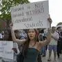 People hold up signs during the Harvard Students for Freedom rally in support of international students at the Harvard University campus in Boston, Massachusetts, on May 27, 2025. Harvard students protested Tuesday after the US government said it intends to cancel all remaining financial contracts with the university, President Donald Trump's latest attempt to force the prestigious institution to submit to unprecedented oversight. (Photo by Rick Friedman / AFP)