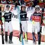 Norway's Atle Lie McGrath, center, winner of an alpine ski, men's World Cup slalom, celebrates with second-placed Norway's Timon Haugan, left, and third-placed Norway's Henrik Kristoffersen, in Wengen, Switzerland, Sunday, Jan. 19, 2025 (AP Photo/Gabriele Facciotti)