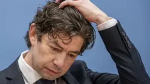 Christian Drosten, Director of the Institute of Virology, Charité Berlin, takes part in a press conference on the current situation in the Corona pandemic in Berlin, Germany, Friday, Jan.22, 2021. (Michael Kappeler/dpa Pool via AP)