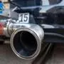 (FILES) This file photo taken on April 17, 2018 shows the exhaust pipe of a diesel powered Volkswagen Golf testcar of German electronic and engineering company Bosch with a portable emission measurement system is displayed in Stuttgart, southern Germany. - German prosecutors searched car giant Volkswagen's offices on December 3, 2019 over the long-running "dieselgate" emissions cheating scandal, the company said, adding it was cooperating with authorities. (Photo by THOMAS KIENZLE / AFP)