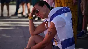 Shiri Tamam, an Israeli Canadian reacts during a memorial marking two years anniversary of the deadly Oct. 7, 2023 Hamas attack on Israel, in Tel Aviv, Israel, Tuesday, Oct. 7, 2025. (AP Photo/Emilio Morenatti)