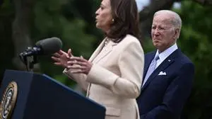 (FILES) US President Joe Biden looks on as US Vice President Kamala Harris delivers remarks during National Small Business Week in the Rose Garden of the White House in Washington, DC, on May 1, 2023. US President Joe Biden announced July 21, 2024 that he is dropping out of his reelection battle with Donald Trump, in a historic move that plunges the already turbulent 2024 White House race into uncharted territory. Biden also said he was endorsing Vice President Kamala Harris as the Democratic nominee for the 2024 election after he dropped out of the race. (Photo by Brendan SMIALOWSKI / AFP)
