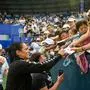 Tunisia’s Ons Jabeur signs autographs after winning her women’s singles final match against Russia’s Diana Shnaider at the WTA Ningbo Open tennis tournament in Ningbo, in China's eastern Zhejiang province on September 30, 2023. (Photo by AFP) / China OUT