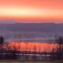 Sonnenaufgang mit Saharastaub über dem Stubenbergsee