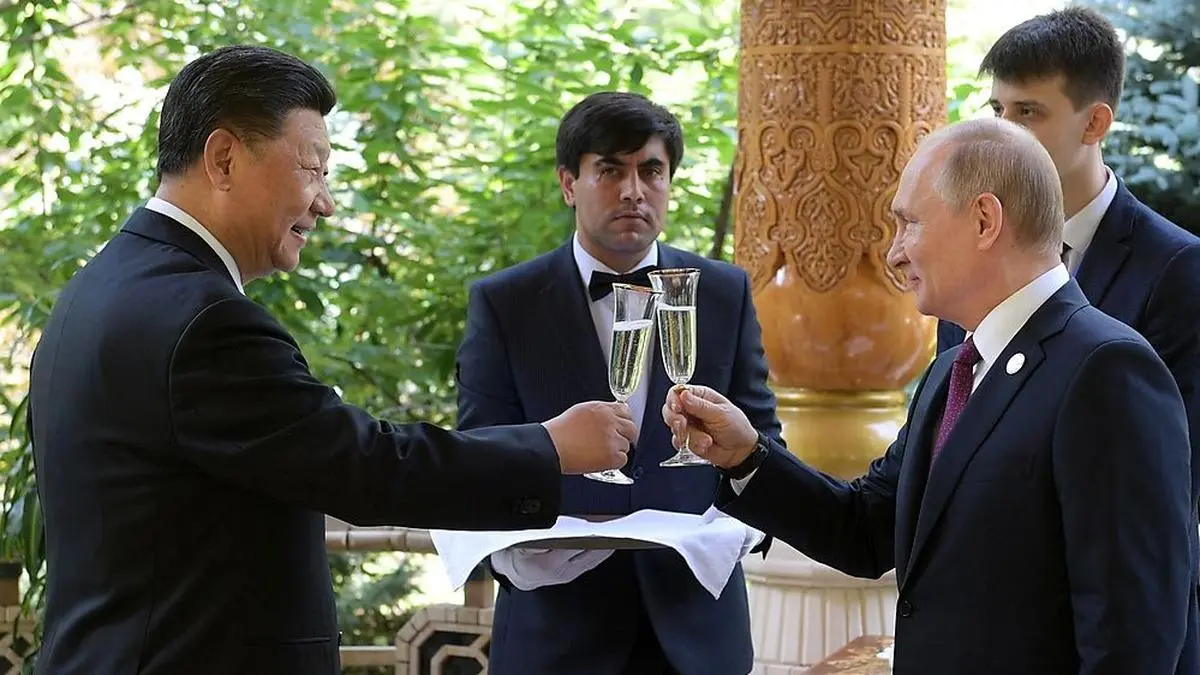 In this photo taken on Friday, June 14, 2019, Russian President Vladimir Putin, right, toasts with Chinese President Xi Jinping prior to the Conference on Interaction and Confidence Building Measures in Asia (CICA) in Dushanbe, Tajikistan. (Alexei Druzhinin, Sputnik, Kremlin Pool Photo via AP)