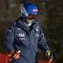 United States' Mikaela Shiffrin concentrates ahead of an alpine ski, women's World Cup downhill race, in Cortina d'Ampezzo, Italy, Friday, Jan. 26, 2024. Shiffrin crashed into the safety nets after losing control landing a jump during a World Cup downhill on Friday. (AP Photo/Gabriele Facciotti)