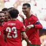 Portugal's midfielder #10 Bernardo Silva (L), Portugal's midfielder #23 Vitinha and Portugal's forward #07 Cristiano Ronaldo (R) celebrate Turkey's defender #04 Samet Akaydin's own goal during the UEFA Euro 2024 Group F football match between Turkey and Portugal at the BVB Stadion in Dortmund on June 22, 2024. (Photo by FRANCK FIFE / AFP)