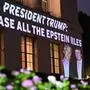 A message calling on President Donald Trump to release all files related to Jeffrey Epstein is projected onto the U.S. Chamber of Commerce building across from the White House in Washington, DC, on July 18, 2025. President Donald Trump's administration said it would seek the release of grand jury testimony related to Jeffrey Epstein, as the US president sought to dispel lingering political fallout over his team's handling of the late financier's sex trafficking case. Attorney General Pam Bondi said the Justice Department will ask a court to unseal the grand jury transcripts, as Trump's relationship with Epstein came under the spotlight again over an alleged off-color letter published by the Wall Street Journal. (Photo by Alex WROBLEWSKI / AFP)