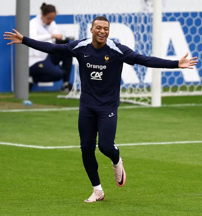 France's forward #10 Kylian Mbappe gestures during a training session ahead of the UEFA Euro 2024 football Championship at the Home Deluxe Arena Stadium in Paderborn, western Germany, on June 12, 2024. (Photo by FRANCK FIFE / AFP)