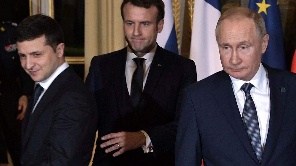 Wolodimir Selenskij, Emmanuel Macron und Wladimir Putin