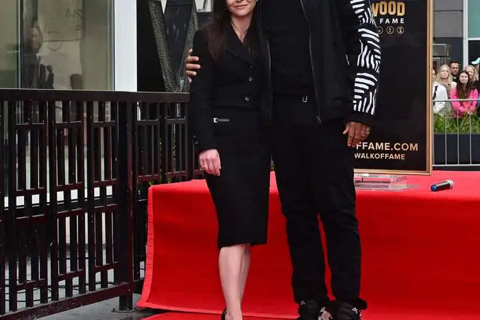 US actress Christina Ricci and director Jeff W. Byrd stand beside Ricci's just unveiled Hollywood Walk of Fame Star during a ceremony on March 6, 2025 in Hollywood, California. (Photo by Frederic J. BROWN / AFP)