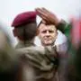 TOPSHOT - France's President Emmanuel Macron reviews French troops standing to attention during a ceremony commemorating SAS paratroopers and Free French Forces who died in Brittany during World War II, at La Gree mill SAS (Special Air Service) memorial in Plumelec, western France, on June 5, 2024, as part of the "D-Day" commemorations marking the 80th anniversary of the World War II Allied landings in Normandy. The D-Day ceremonies on June 6 this year mark the 80th anniversary since the launch of 'Operation Overlord', a vast military operation by Allied forces in Normandy, which turned the tide of World War II, eventually leading to the liberation of occupied France and the end of the war against Nazi Germany. (Photo by Benoit Tessier / POOL / AFP)