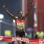 Kenya's Ruth Chepngetich celebrates after winning the Women's Marathon at the 2019 IAAF World Athletics Championships in Doha on September 27, 2019. (Photo by MUSTAFA ABUMUNES / AFP)