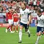 Harry Kane | England's forward #09 Harry Kane celebrates scoring his team's first goal next to England's defender #12 Kieran Trippier (R) during the UEFA Euro 2024 Group C football match between Denmark and England at the Frankfurt Arena in Frankfurt am Main on June 20, 2024. (Photo by JAVIER SORIANO / AFP)