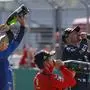 Race winner Mercedes driver Valtteri Bottas of Finland, right, celebrates with second placed Ferrari driver Charles Leclerc of Monaco, front, and third placed Mclaren driver Lando Norris of Britain after the Austrian Formula One Grand Prix at the Red Bull Ring racetrack in Spielberg, Austria, Sunday, July 5, 2020. (Leonhard Foeger/Pool via AP)