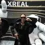 A model wears Xreal augmented reality glasses are modeled at a booth during the CES tech show, Wednesday, Jan. 8, 2025, in Las Vegas. (AP Photo/John Locher)