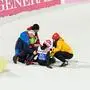 Germany's Luisa Goerlich receives assistance after a crash during the women's individual normal hill qualification at the FIS Ski Jumping World Championships in Trondheim, Norway on February 27, 2025. (Photo by Ole Martin Wold / NTB / AFP) / Norway OUT