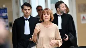 TOPSHOT - Gisele Pelicot (C) arrives to attend a session of the trial of her former partner Dominique Pelicot accused of drugging her for nearly ten years and inviting strangers to rape her at their home in Mazan, a small town in the south of France, in Avignon, on September 11, 2024. A court in the southern town of Avignon is trying Dominique Pelicot, a 71-year-old retiree, for repeatedly raping and enlisting dozens of strangers to rape his heavily sedated wife in her own bed over a decade. Fifty other men, aged between 26 and 74, are also on trial for alleged involvement, in a case that has horrified France. The court proceedings, which runs until December, are open to the public at the request of Dominique Pelicot's ex-wife and victim. (Photo by Christophe SIMON / AFP)