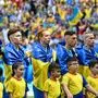 TOPSHOT - Ukraine's players line up prior to the UEFA Euro 2024 Group E football match between Romania and Ukraine at the Munich Football Arena in Munich on June 17, 2024. (Photo by Miguel MEDINA / AFP)