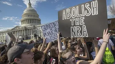 CORRECTS TO MARJORY STONEMAN DOUGLAS HIGH SCHOOL, NOT PARKLAND - In this Feb. 21, 2018, photo, school students from Montgomery County, Md., in suburban Washington, rally in solidarity with those affected by the shooting at Marjory Stoneman Douglas High School in Florida, at the Capitol in Washington. Member of Congress return from a 10-day recess under enormous pressure to respond to gun violence after the Parkland high school shooting. Despite a long list of legislative proposals, including many flowing from President Donald Trump, few ideas seem poised for passage. (AP Photo/J. Scott Applewhite, File)